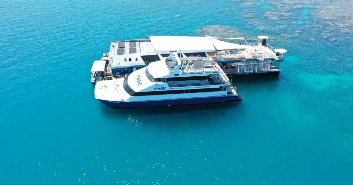 Reef catamaran moored beside an outer reef pontoon off Cairns