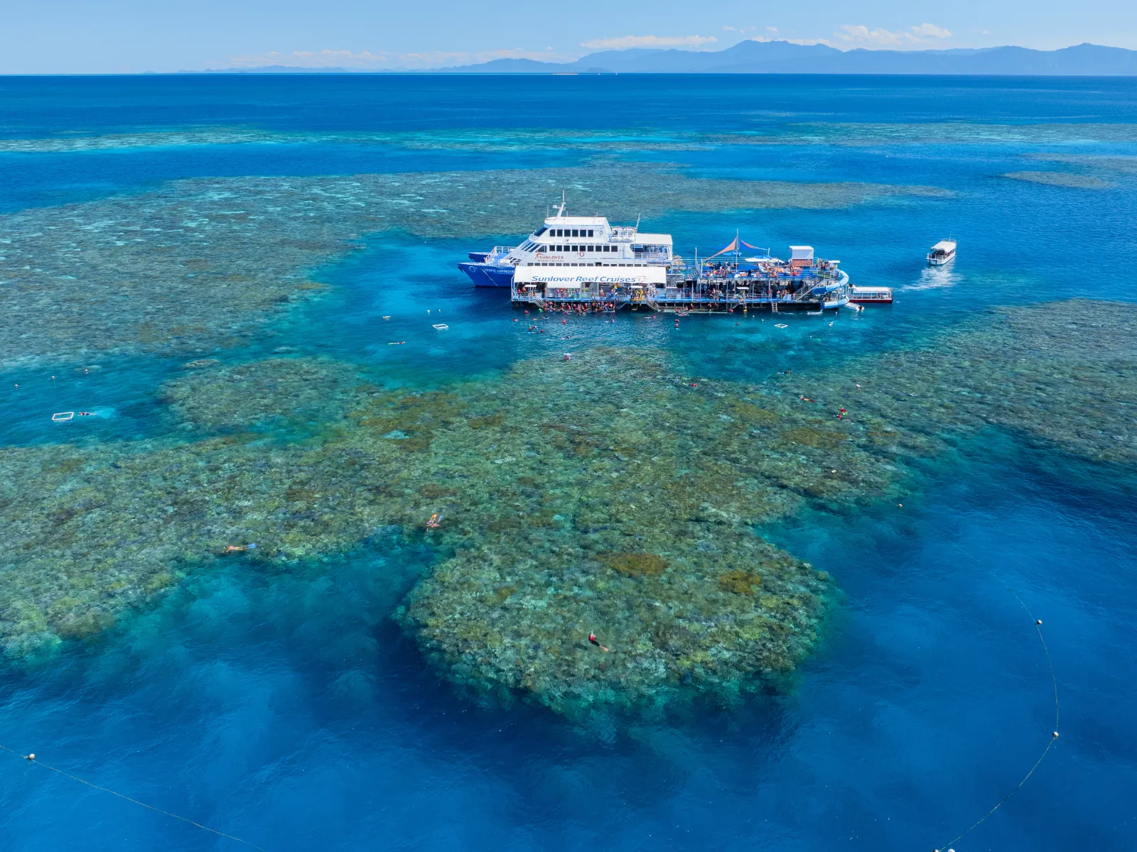 Aerial view of the reef pontoon and boat on the outer reef
