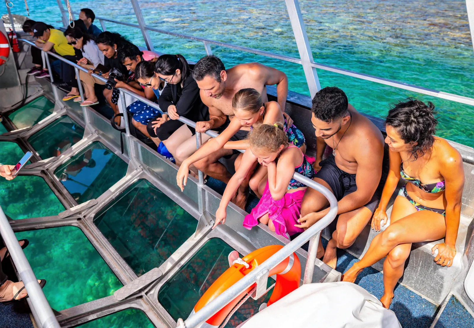 Guests watching the reef through semi-submersible windows