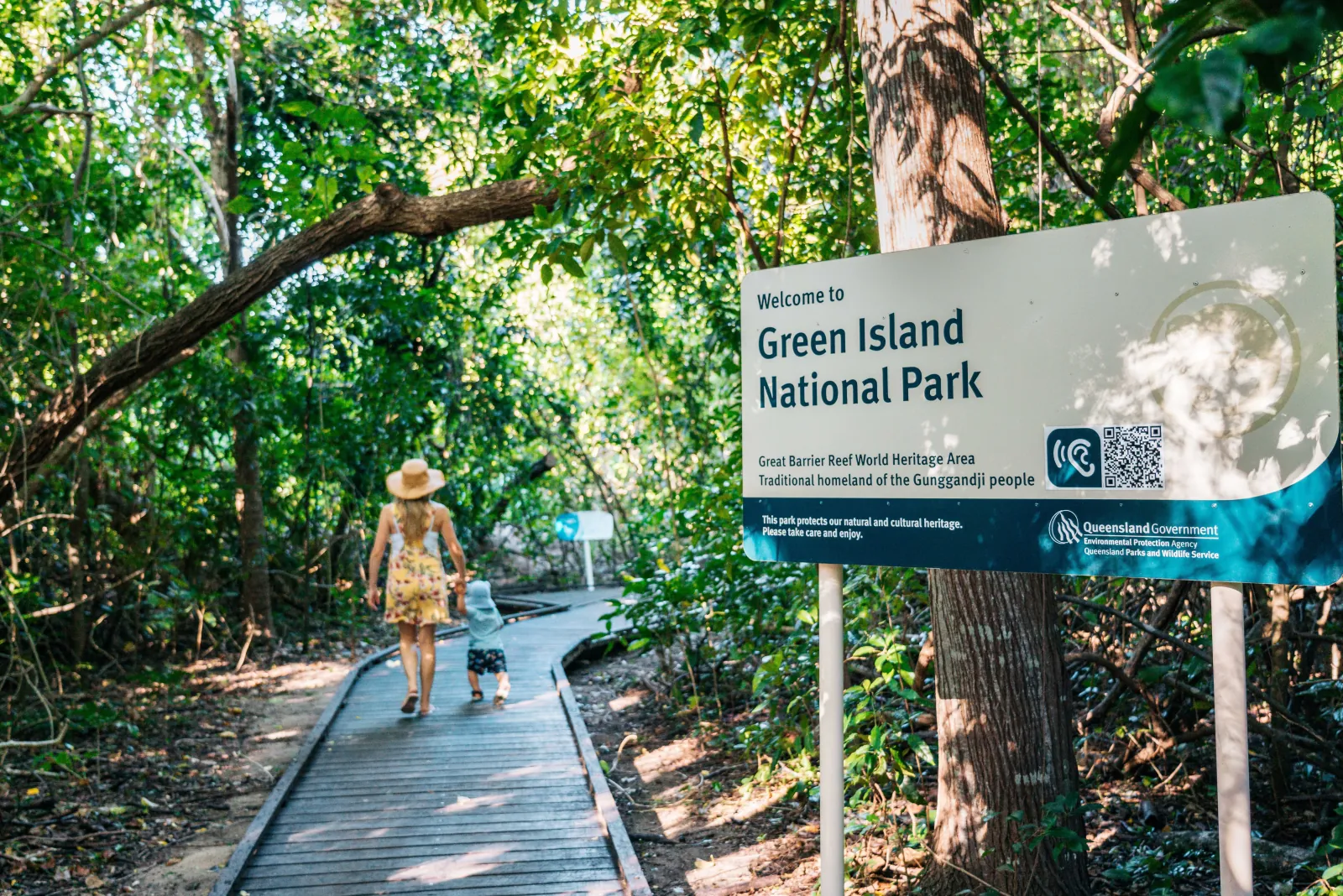 Boardwalk through the rainforest at the Green Island National Park sign