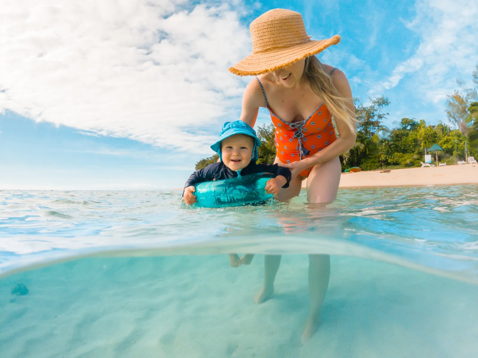 Parent and child in the shallows of Green Island
