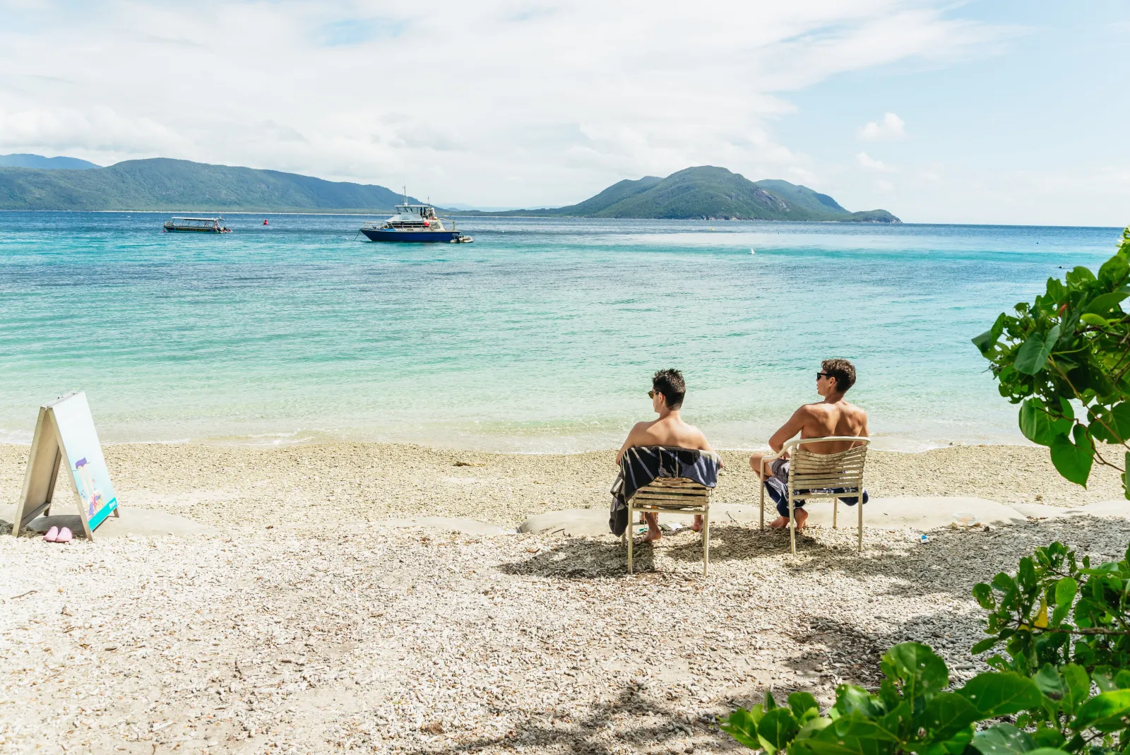 Visitors relaxing on the sand at Fitzroy Island