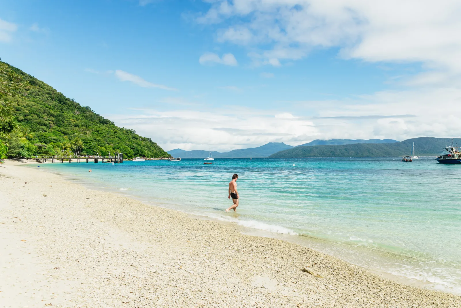 Swimmer on the beach at Fitzroy Island