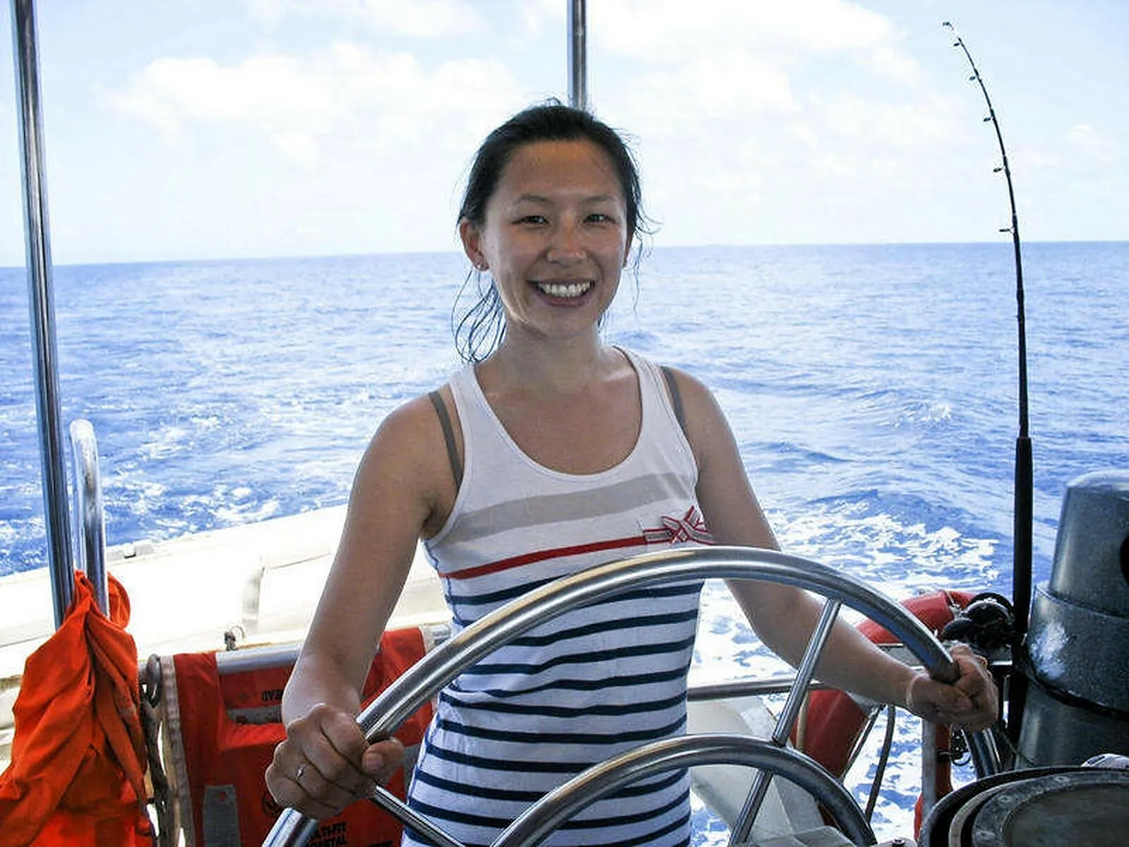 Guest steering the sailing boat