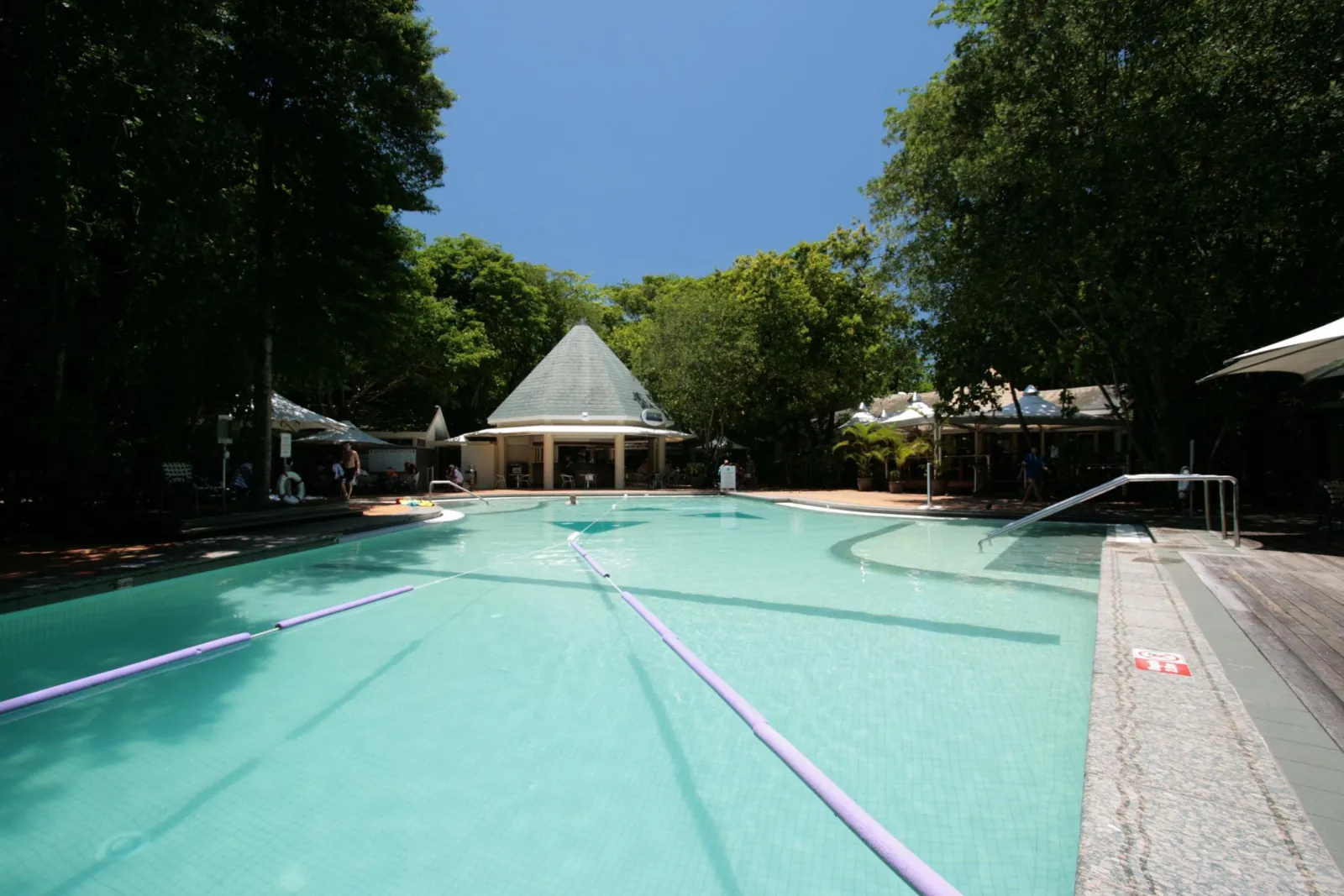 Island swimming pool among the trees on Green Island