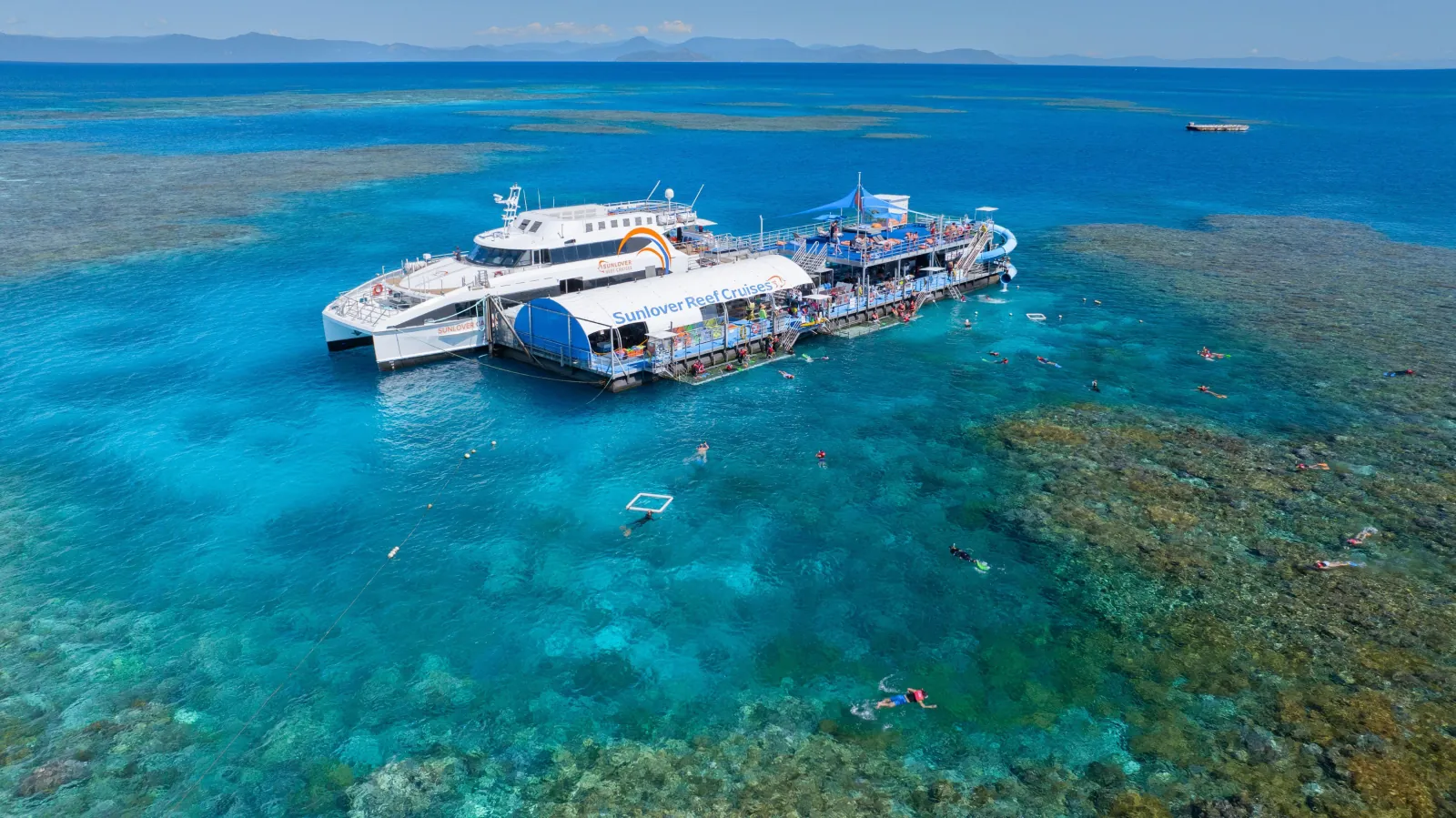 Two catamarans moored at a reef pontoon