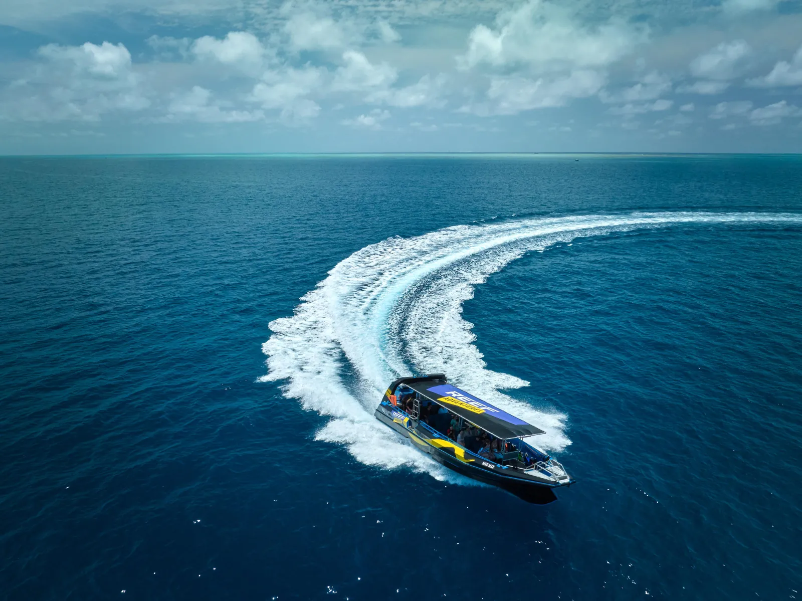 Fast boat turning at speed on the way to the reef