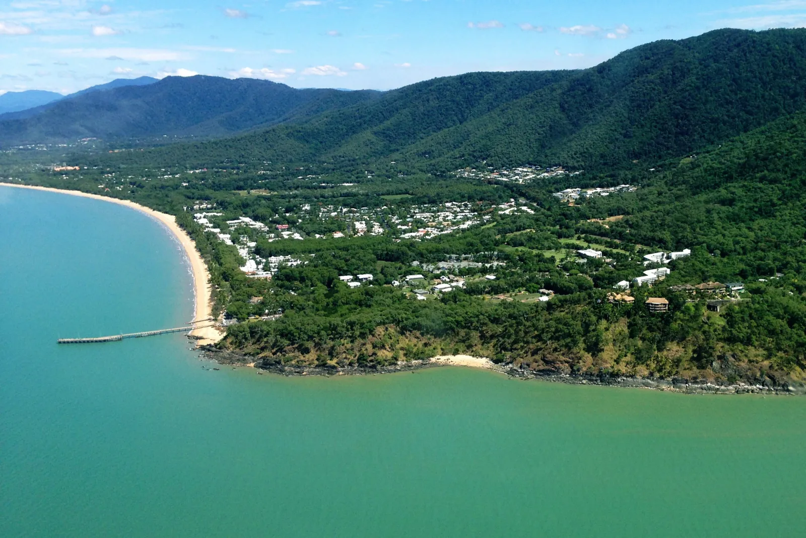 Aerial view of the coast and rainforest-covered ranges near Cairns